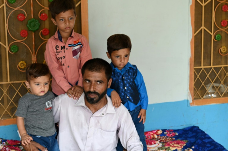 Butt, surrounded by his children, described the anguish of spending eight days floundering on a fishing boat only to then end up in a Libyan jail