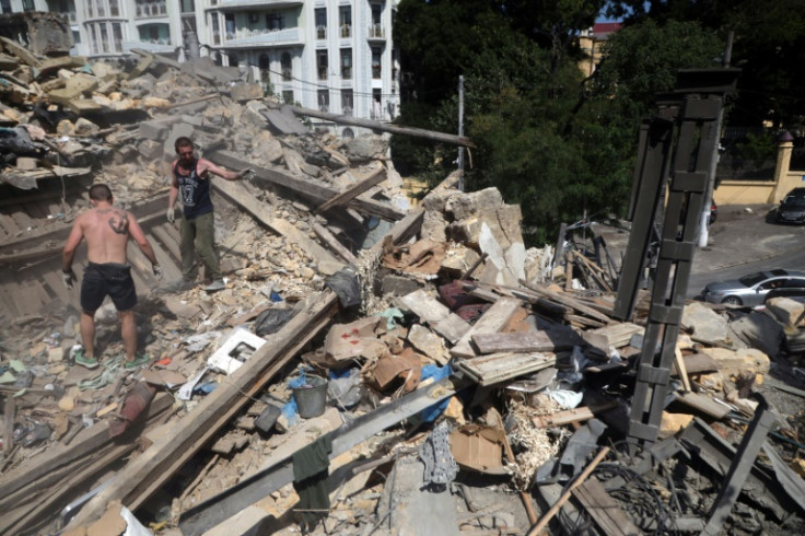 Workers clear the rubble after strikes in Odesa, some of the worst since Russia invaded last February