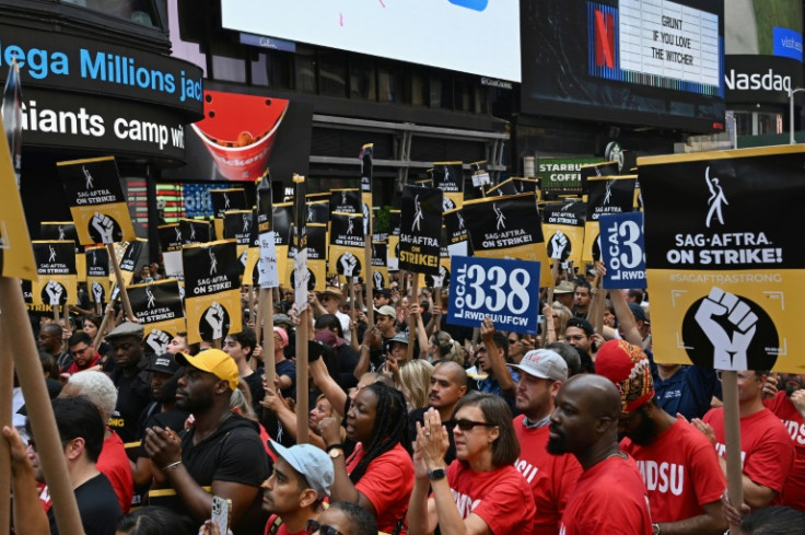 Screen Actors Guild (SAG-AFTRA) members and supporters cheer at a strike rally in Times Square