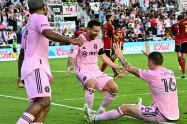 Lionel Messi celebrates scoring Inter Miami's second goal with team-mate Robert Taylor -- Messi and Taylor scored twice each in the 4-0 win over Atlanta United on Tuesday