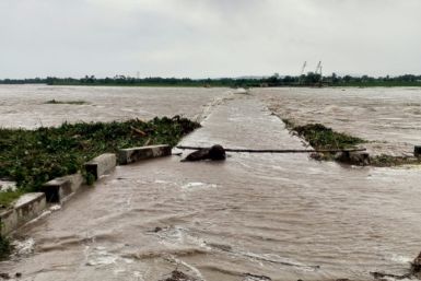 A flooded bridge is seen in Cagayan province, Philippines, after a river overflowed due to heavy rains brought by Typhoon Doksuri