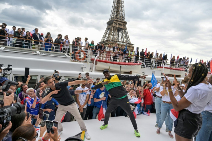 Usain Bolt and the chief organiser of the 2024 Paris Olympics Tony Estanguet strike the Jamaican former sprinter's 'Lightning Bolt' pose in front of the Eiffel Tower