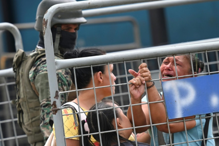 Family members gather outside an Ecuadoran prison, desperate for news from their loved ones on the inside