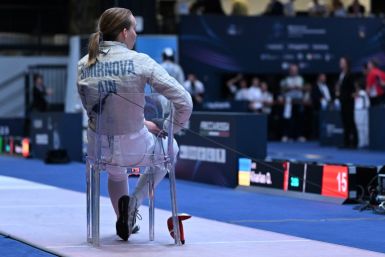 Russia's Anna Smirnova, competing as a neutral athlete sat in her chair for 10 minutes in protest at the refusal of her Ukrainian opponent Olha Kharlan to shake her hand following their bout