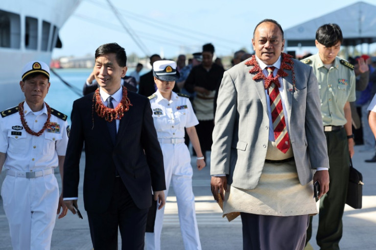 Tonga's Prime Minister Siaosi Sovaleni with the Chinese Ambassador to Tonga Cao Xiaolin (L) welcome the Chinese naval hospital ship 'Peace Ark' on her third goodwill visit to Tonga in Nuku'alofa on July 28, 2023.  The humanitarian medical mission from 28 