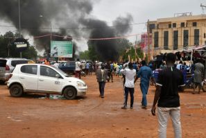 Smoke billows in Niamey, the capital of Niger, on July 27, 2023