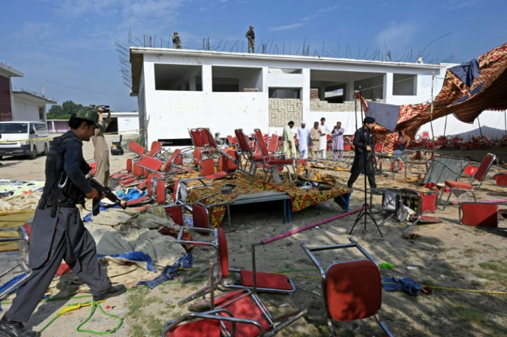 On Monday, blood-stained shoes and prayer caps littered the site, along with ball bearings and steel bolts from the suicide vest