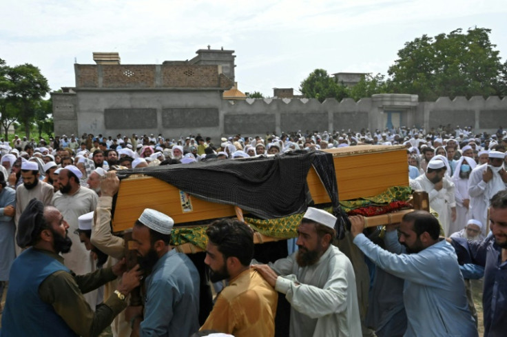 Thousands of mourners attended the first funeral ceremonies, including for two young cousins aged 16 and 17