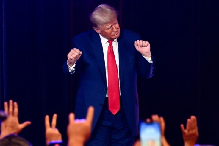 Former US president and 2024 Republican presidential hopeful Donald Trump, pictured dancing at a campaign event, is facing multiple felony charges