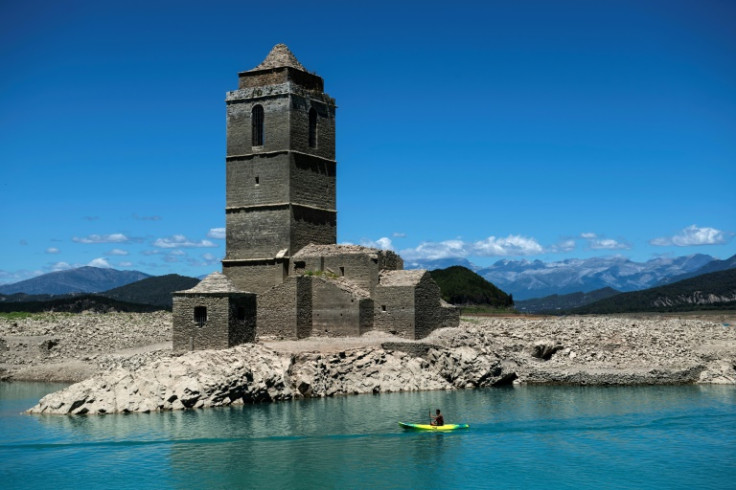 The ruins of the Church of Mediano, normally submerged  in the waters of the Mediano reservoir, are now visible due to the ongoing drought