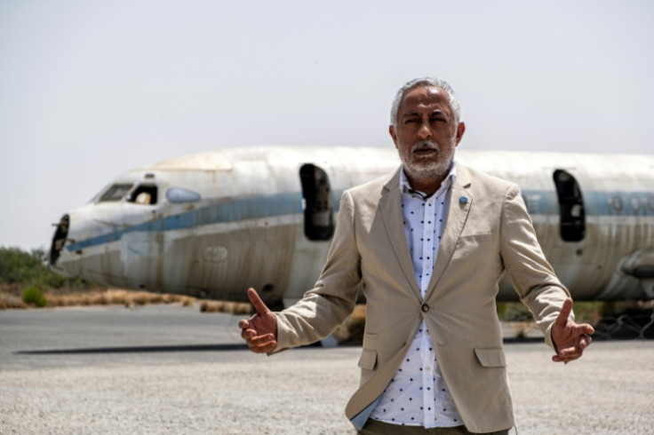 'This is not a playground... this is a military zone,' says UN peackeeping force spokesman Aleem Siddique, in front of an abandoned Cyprus Airways aircraft in the UN buffer zone