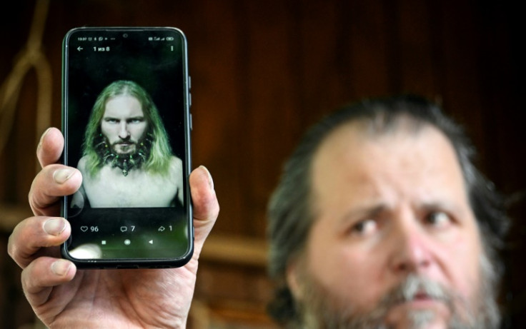 Musician Valentin Sokhorev, 52, shows a photo of his late friend Anatoly Berezikov
