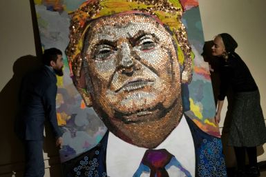 Artists show off a portrait of Donald Trump made of pennies, nickels and dimes in 2018 in New York