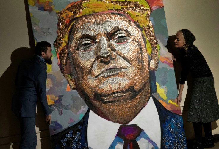 Artists show off a portrait of Donald Trump made of pennies, nickels and dimes in 2018 in New York