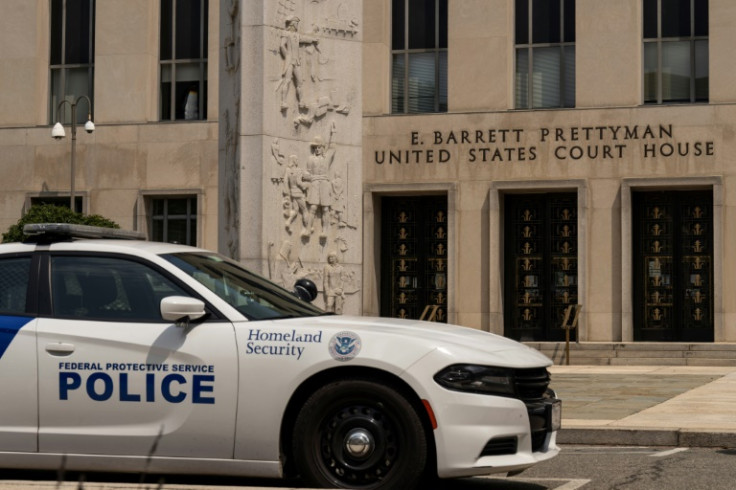 Police outside the E. Barrett Prettyman courthouse where former president Donald Trump is to be arraigned on charges of conspiring to overturn the 2020 election