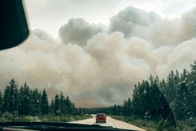 Wildfire smoke engulfing a forest in the northern zone of Canada's Quebec Province in mid July