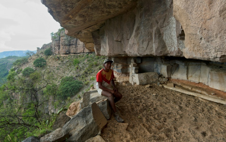 Gerardo Gutierrez, one of Romayne Wheeler's neighbors, shows the cave where the pianist used to stay when he first arrived in the area