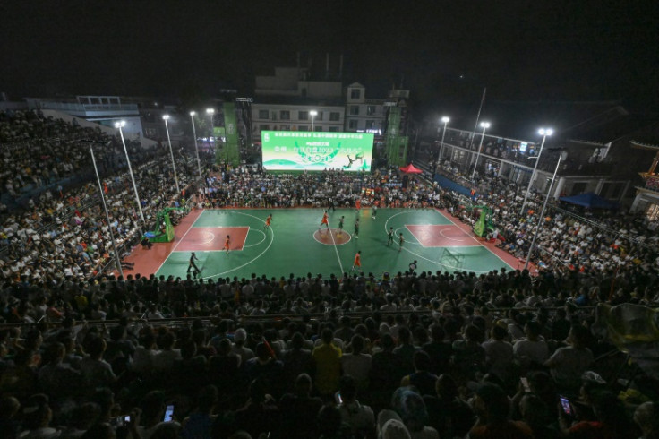 The tiny village's stadium holds over 20,000 fans, but millions more watch the rural basketball tournament online