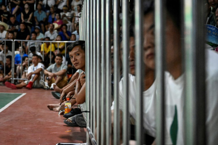 Diehard basketball fans take in the action at the late-July tournament