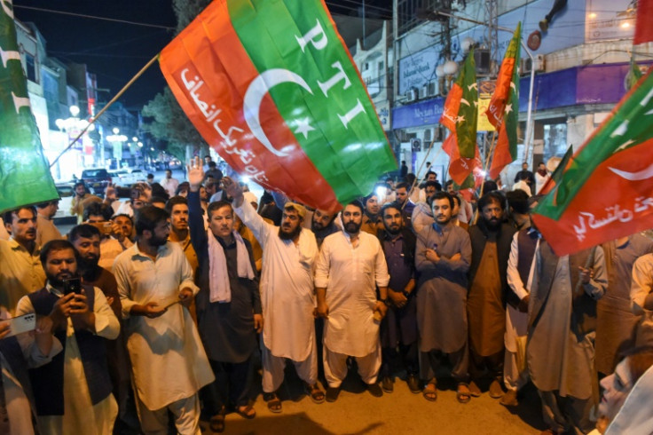 Khan's supporters shout slogans against his arrest during a small rally in Quetta