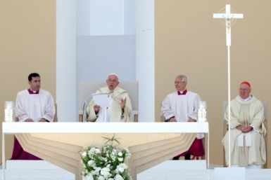 Pope Francis, celebrating mass in Lisbon, said Seoul will host the next World Youth Day in 2027