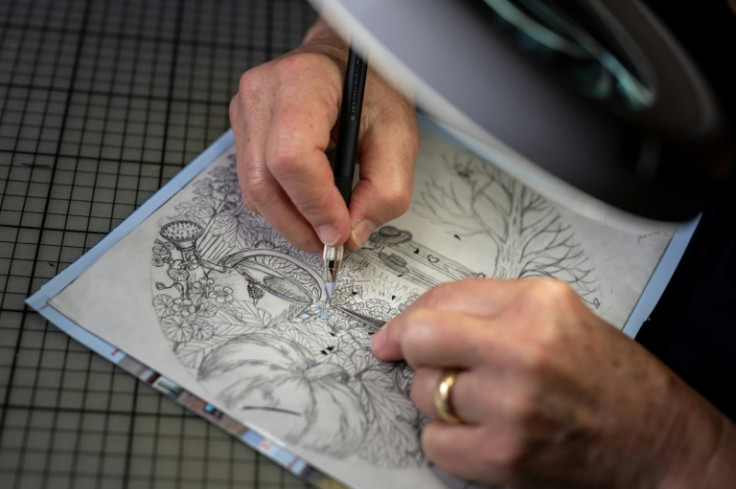 Swiss paper cutting artist Marianne Dubuis works on a piece at her home