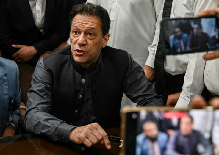 The sentence disqualifies Imran Khan (pictured during a court appearance in July) from taking part in upcoming elections