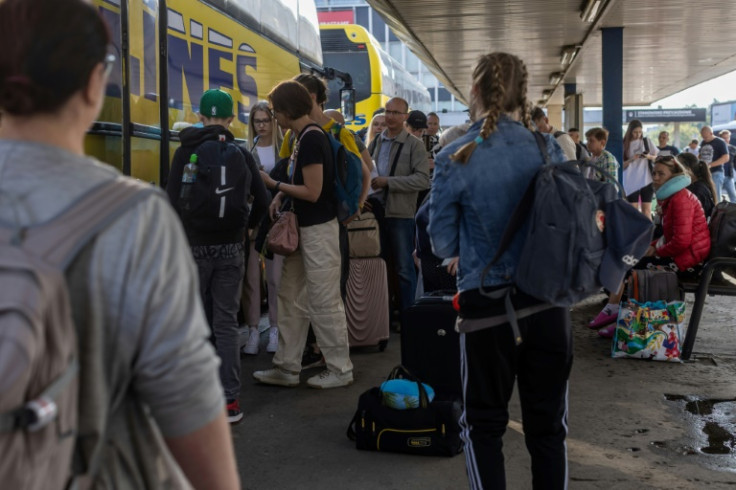 Passengers wait to board a bus to Minsk, Belarus, at Warsaw West bus station