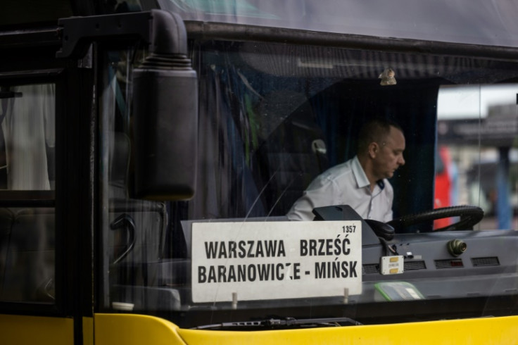 A sign reading 'Warsaw - Brest - Baranavichy - Minsk' is seen at the front of the bus to Minsk, Belarus, at Warsaw West bus station