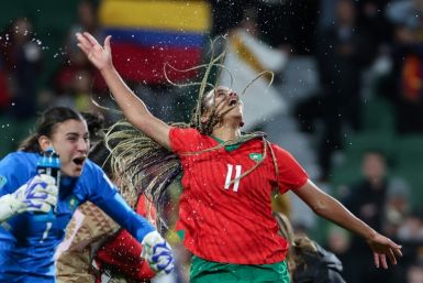 Morocco's goalkeeper  Khadija Er-Rmichi (L) and forward  Fatima Tagnaout celebrate their team's victory over Colombia