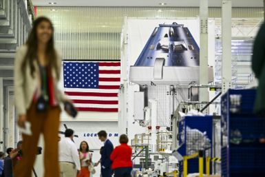 Officials and media personnel are seen inside the Operations and Checkout Building (O&C) at the Kennedy Space Center in Cape Canaveral, Florida
