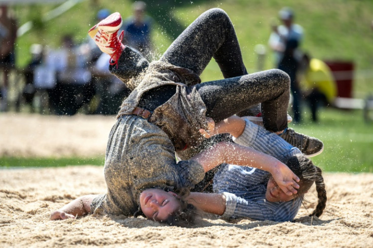 Wrestlers have to pin their opponent's shoulder blades to the ground to win