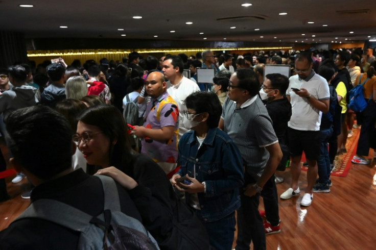 Moviegoers wait in line to watch 'Maria', a documentary on women left behind by Rodrigo Duterte's deadly drug war