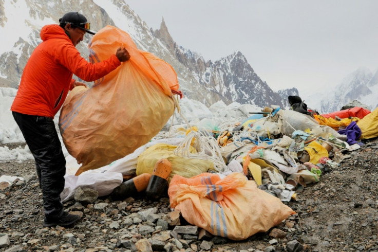 Over a week some 200 kilograms (400 pounds) of litter is hacked from the pinnacle's frozen grip by Sadpara's five-strong team