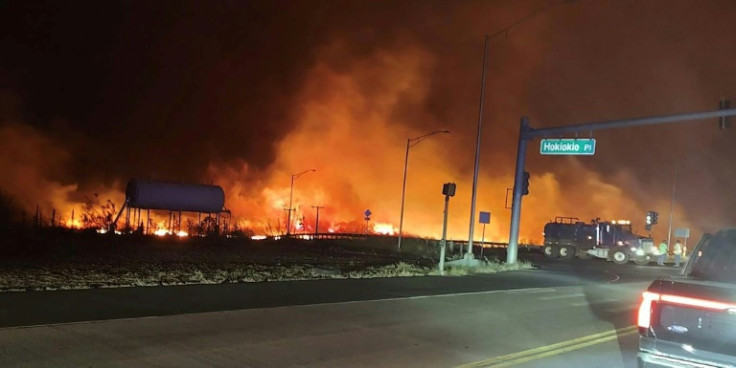 Flames from a Hawaii wildfire stoked by hurricane winds threatened parts of Lahaina, on the island of Maui, and forced evacuations