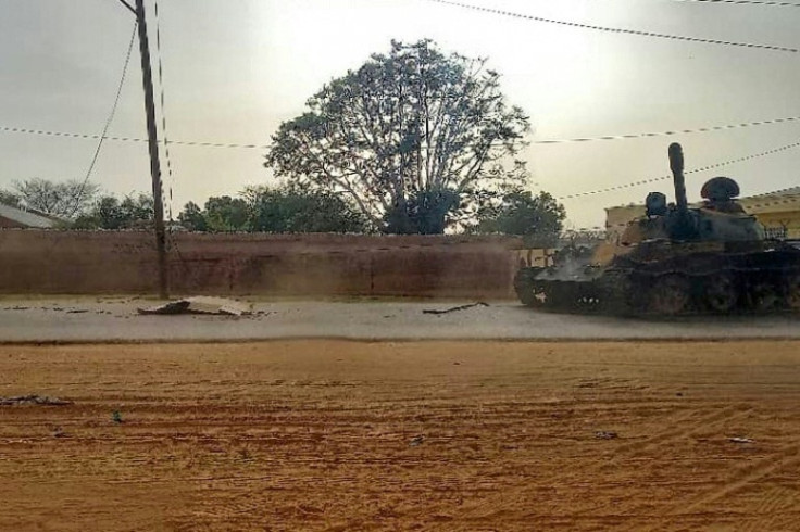 A body lies uncollected in the street in the West Darfur state capital El Geneina, where fighters of the RSF and allied militia stand accused of carrying out killings based on ethnicity