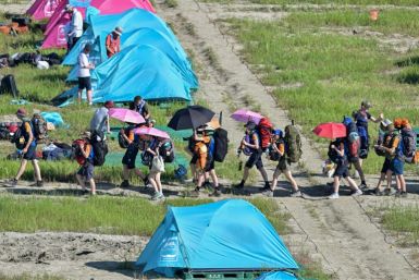 Tens of thousands of scouts were evacuated from their South Korean campsite ahead of a typhoon, just days after a heatwave caused mass illnesses