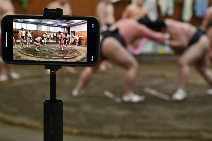 The influx of sumo tourists has caught those offering tours inside "heyas", the stables where wrestlers live and train, by surprise