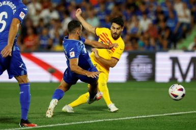 Ilkay Gundogan made his Barcelona debut as the Catalans slugged it out with an aggressive Getafe side