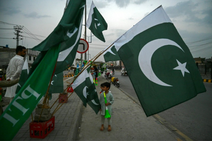 Vendors sell Pakistan flags for Independence Day in Peshawar