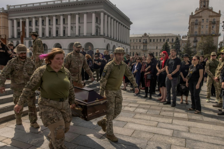 Ukrainian soldiers carry the coffin of Daria Filipieva, an army combat medic