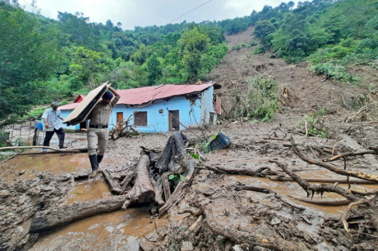 At least 58 people have been killed and more are feared missing in flooding and landslides in India