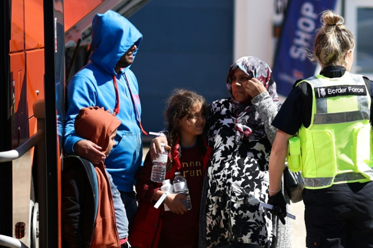 A pregnant woman was also among those taken off a small boat and brought for processing