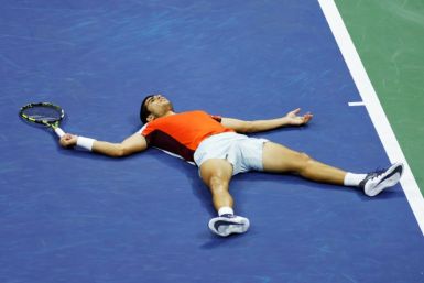 Carlos Alcaraz lies on the court after his late-night US Open quareter final epic last year that finished at 2.50am; tournament organisers said Thursday they had no plans to scrap late games