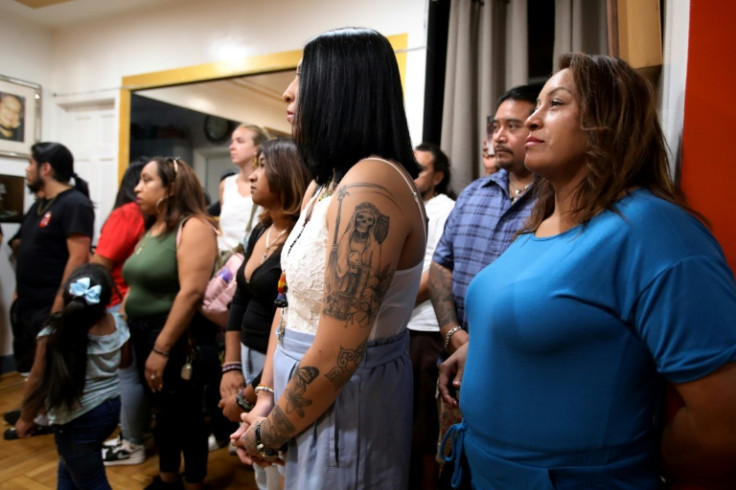 Faithful from around the United States gather before a Santa Muerte altar in New York