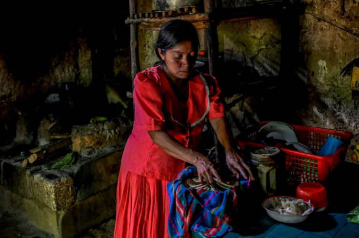 Josefina Roque, 36, makes corn tortillas at her house in Talquezale village, Jocotan, Guatemala