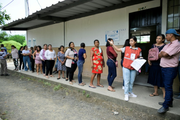 People queue to vote at a polling station in Canuto, Manabi Province, during the Ecuadoran presidential election