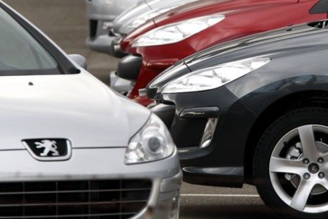 Cars are lined up on a parking lot of French car maker Peugeot in Markolsheim, France