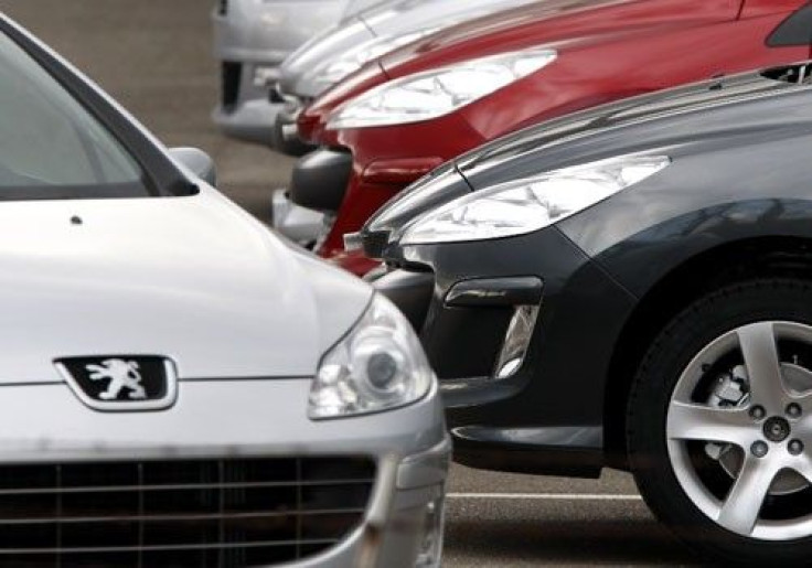 Cars are lined up on a parking lot of French car maker Peugeot in Markolsheim, France