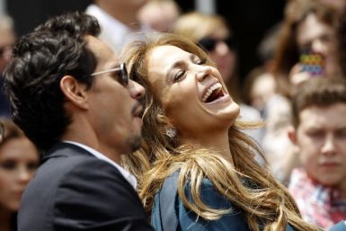 Lopez laughs next to her husband Anthony as they attend the ceremony where producer Fuller was honored with a star on the Walk of Fame in Hollywood